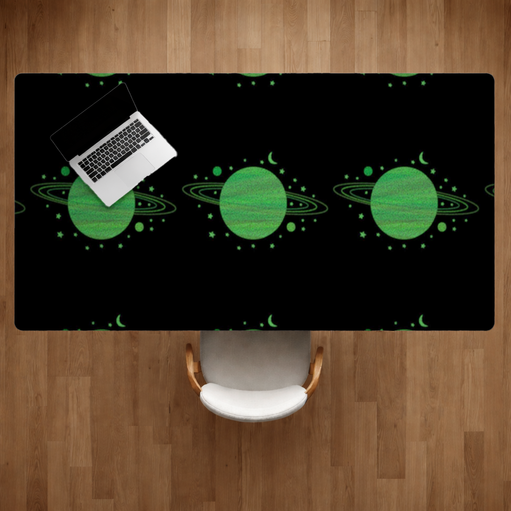 Green planets on a black background. Desk Pad